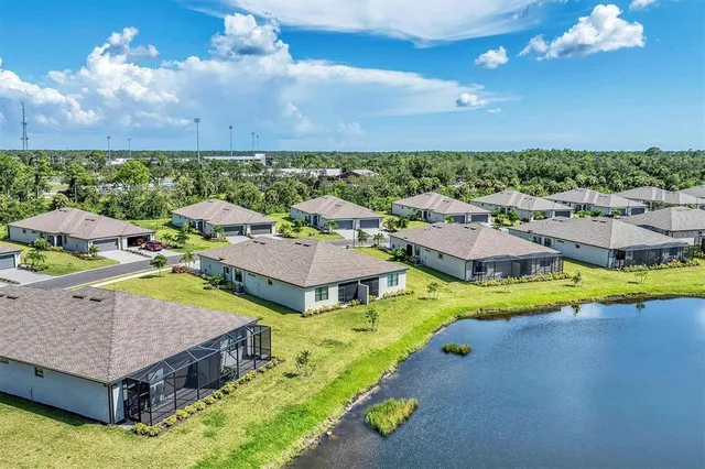 a aerial view of a house with a swimming pool yard and outdoor seating
