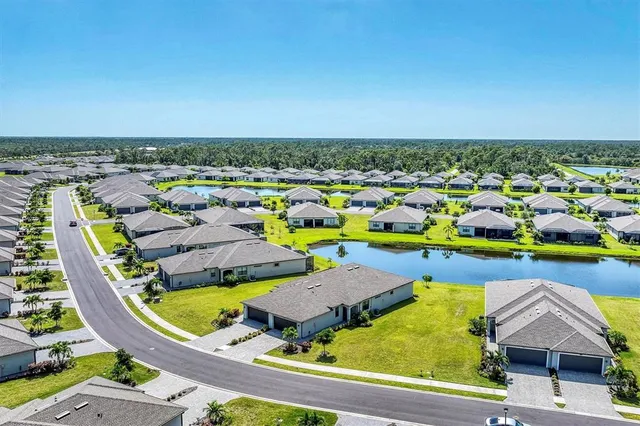 an aerial view of residential houses with outdoor space
