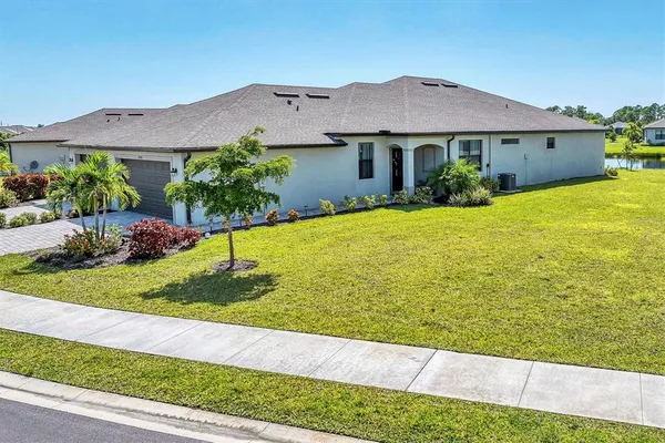 a view of a house with garden and yard
