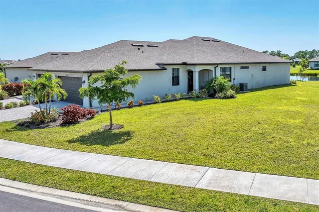 a view of a house with garden and yard