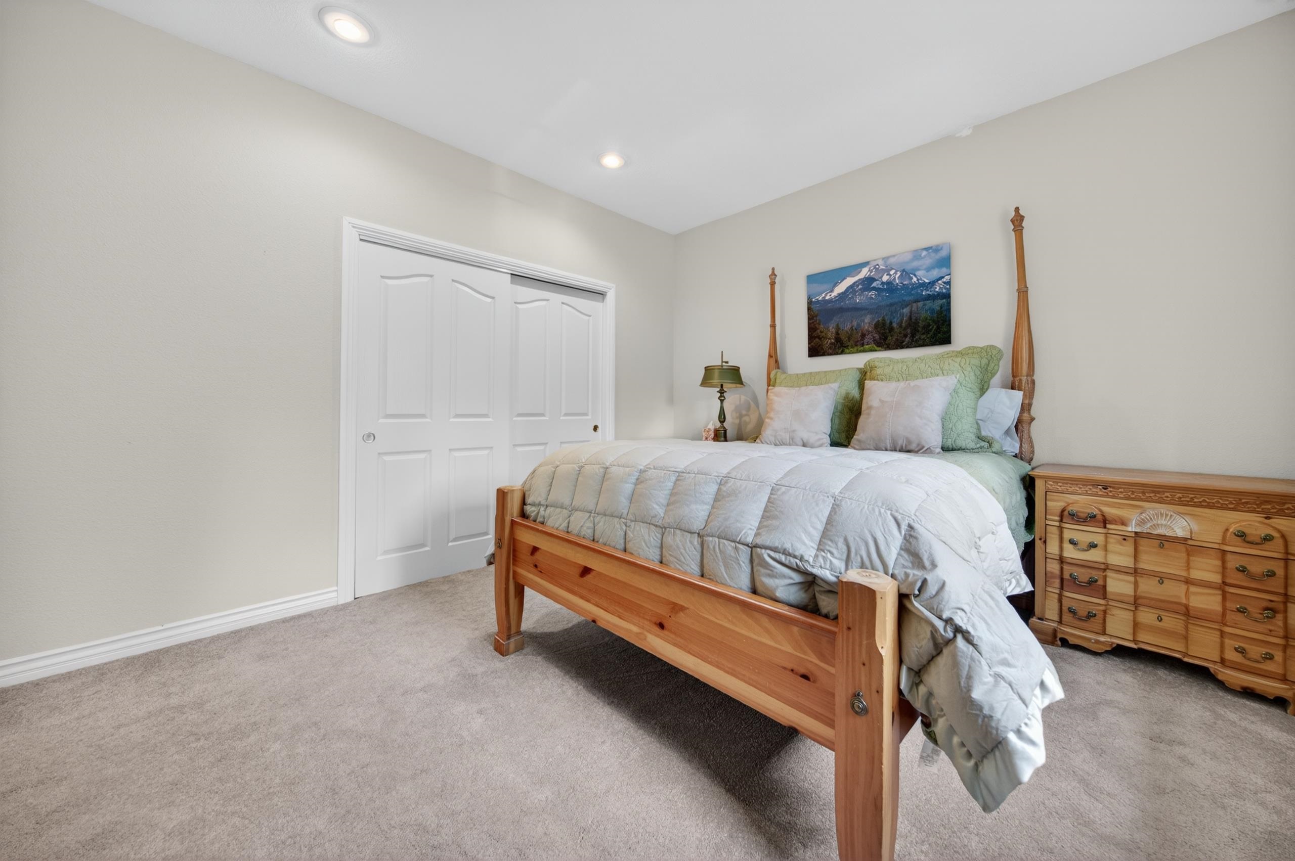 1017 Timber Ridge Road Lake Almanor, CA 96137 - Photo 25 of 45 a bedroom with a bed and a cabinets