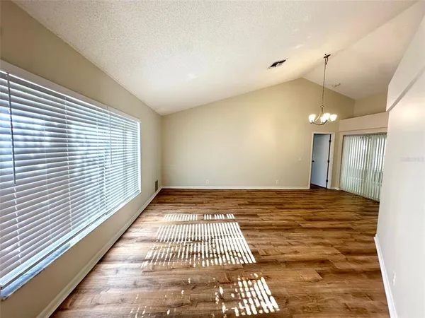 a view of an empty room and window
