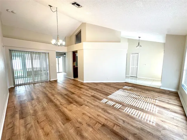 a view of an empty room and window