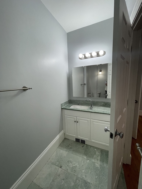 486 Shawmut Avenue, Unit 1 Boston, MA 02118 - Photo 3 of 11 a bathroom with a sink and a mirror