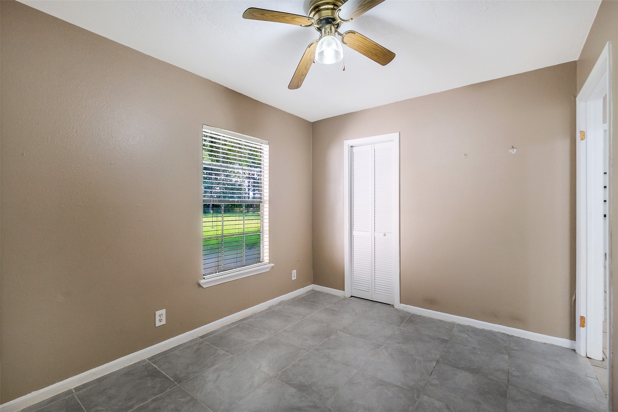 9503 Cardinal Road Beasley, TX 77417 - Photo 12 of 27 a view of an empty room with a window
