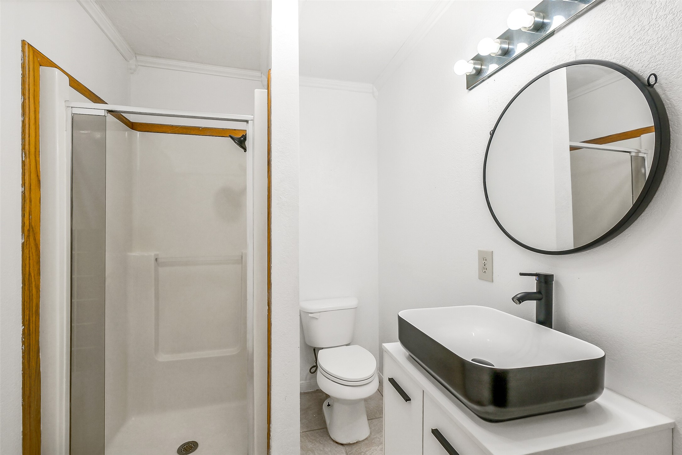 9503 Cardinal Road Beasley, TX 77417 - Photo 13 of 27 a bathroom with a sink a mirror a toilet and a shower