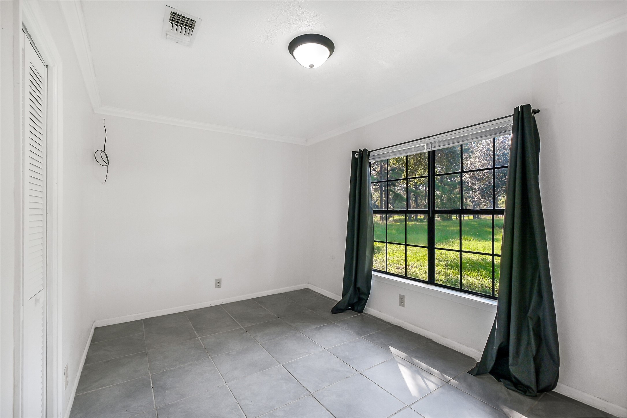 9503 Cardinal Road Beasley, TX 77417 - Photo 14 of 27 a view of an empty room with a window