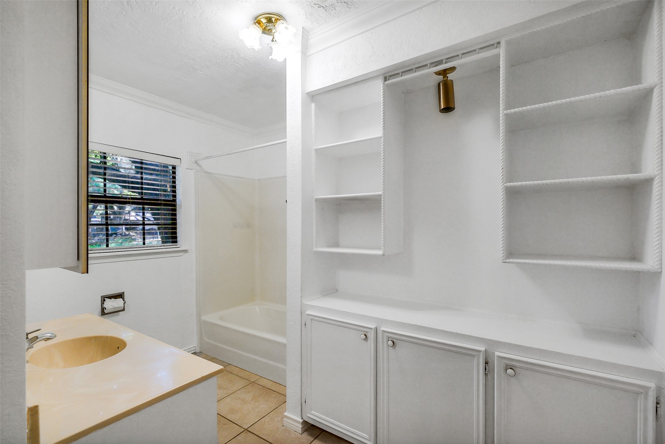9503 Cardinal Road Beasley, TX 77417 - Photo 18 of 27 a bathroom with a sink and a bathtub