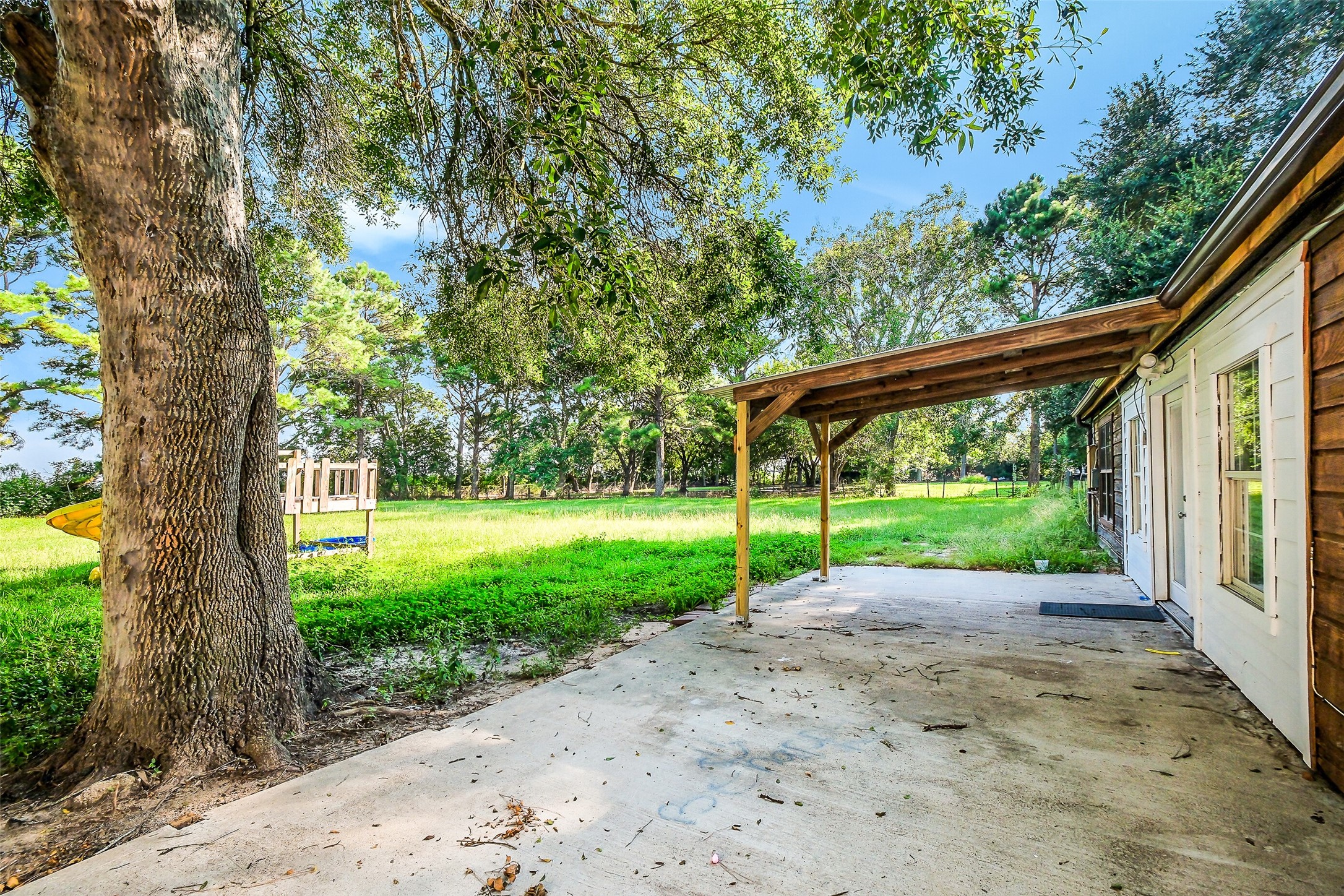 9503 Cardinal Road Beasley, TX 77417 - Photo 21 of 27 a view of a yard with porch