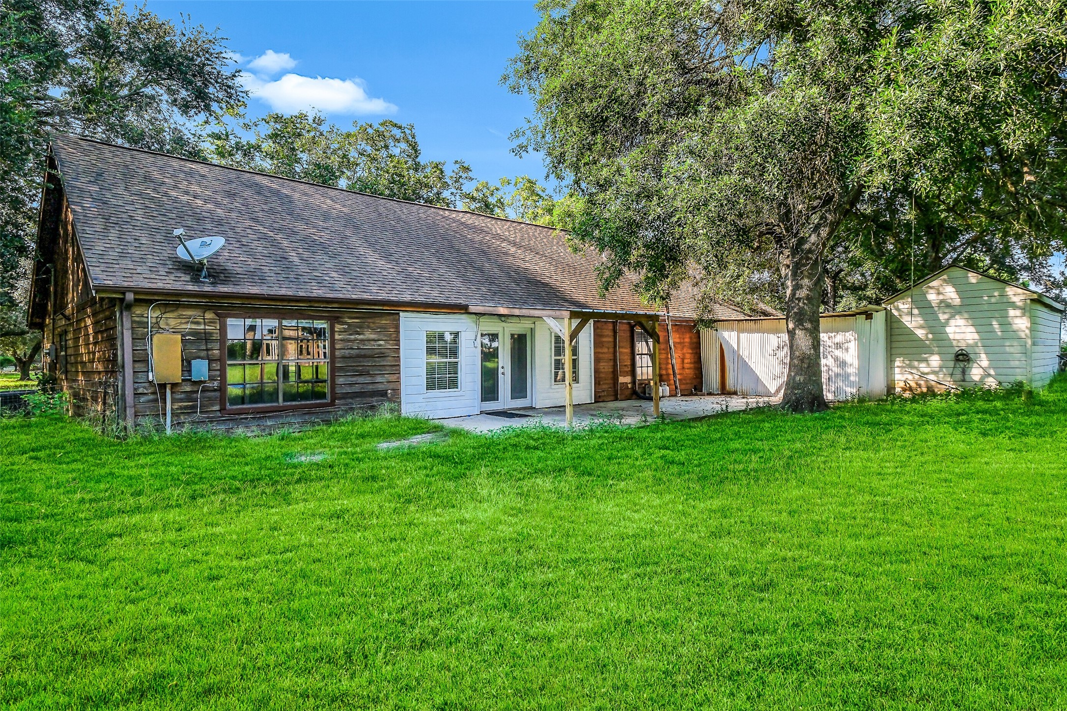 9503 Cardinal Road Beasley, TX 77417 - Photo 22 of 27 a view of a house with a yard and garden
