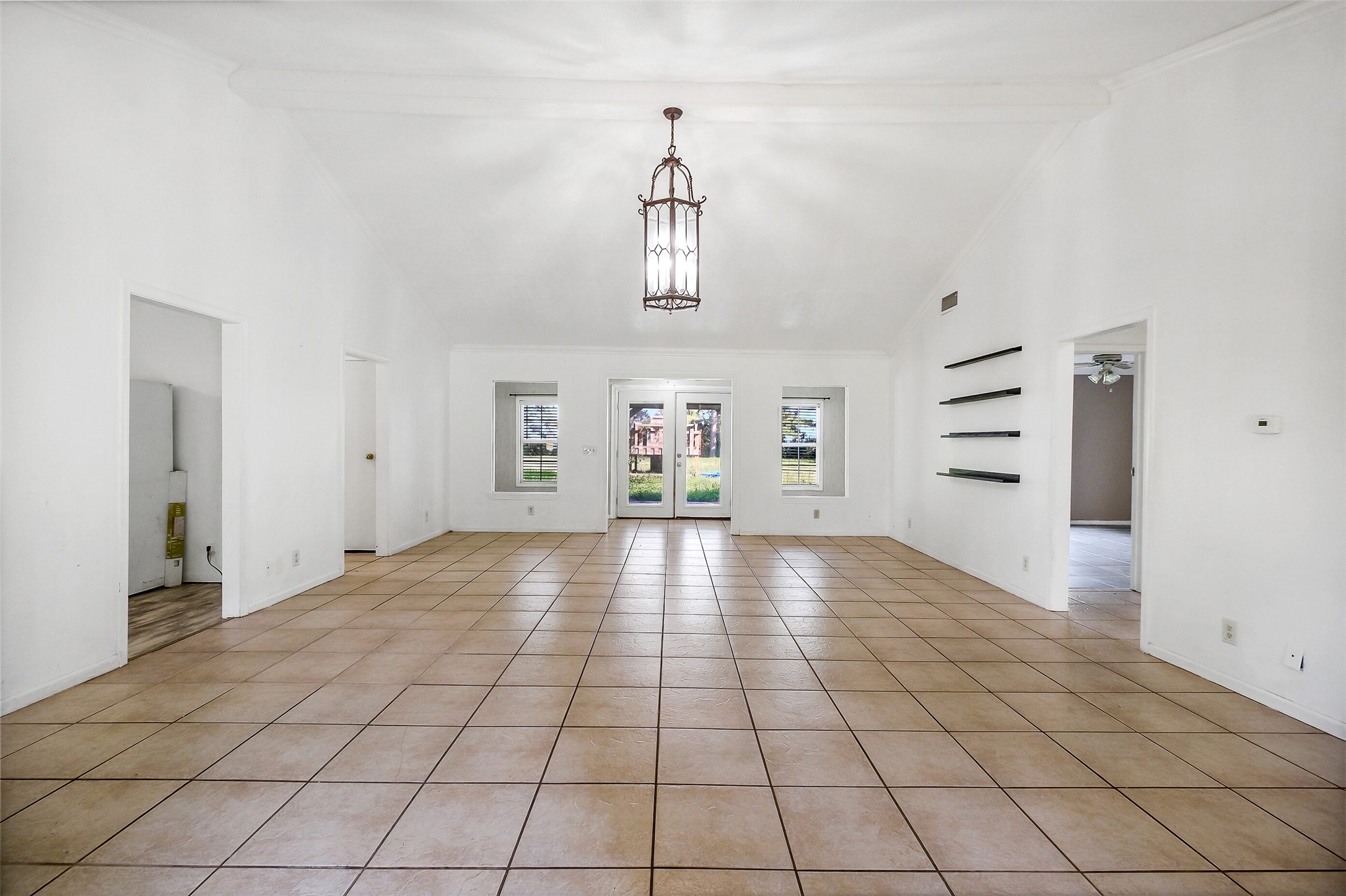 9503 Cardinal Road Beasley, TX 77417 - Photo 3 of 27 a view of an empty room with a window