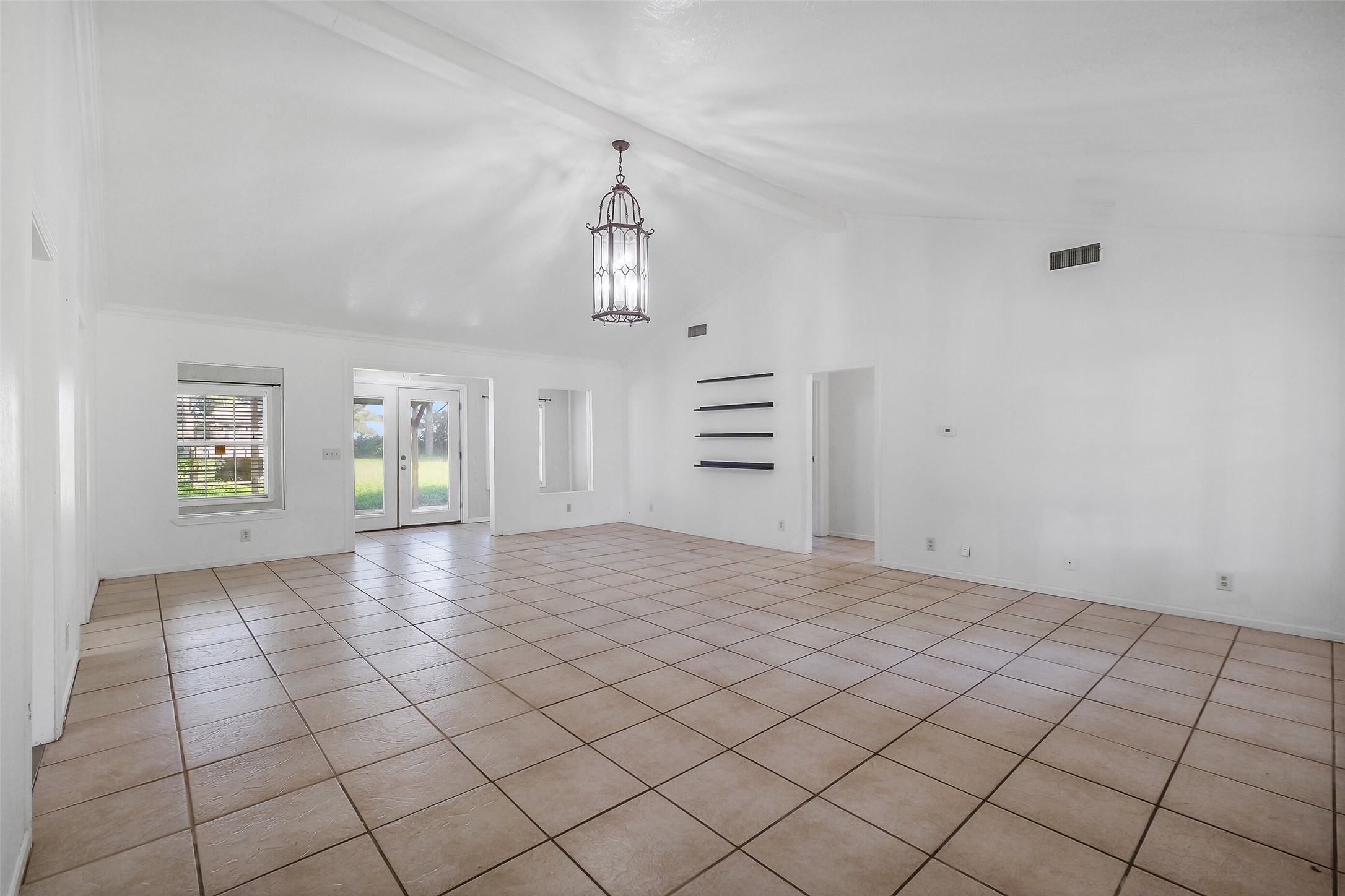 9503 Cardinal Road Beasley, TX 77417 - Photo 4 of 27 a view of empty room with kitchen and window