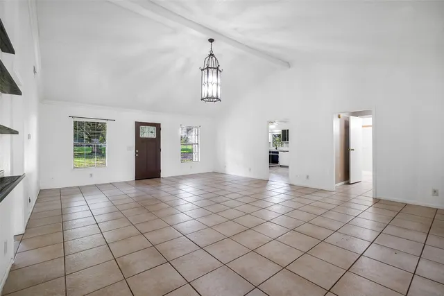 a view of a livingroom with wooden floor