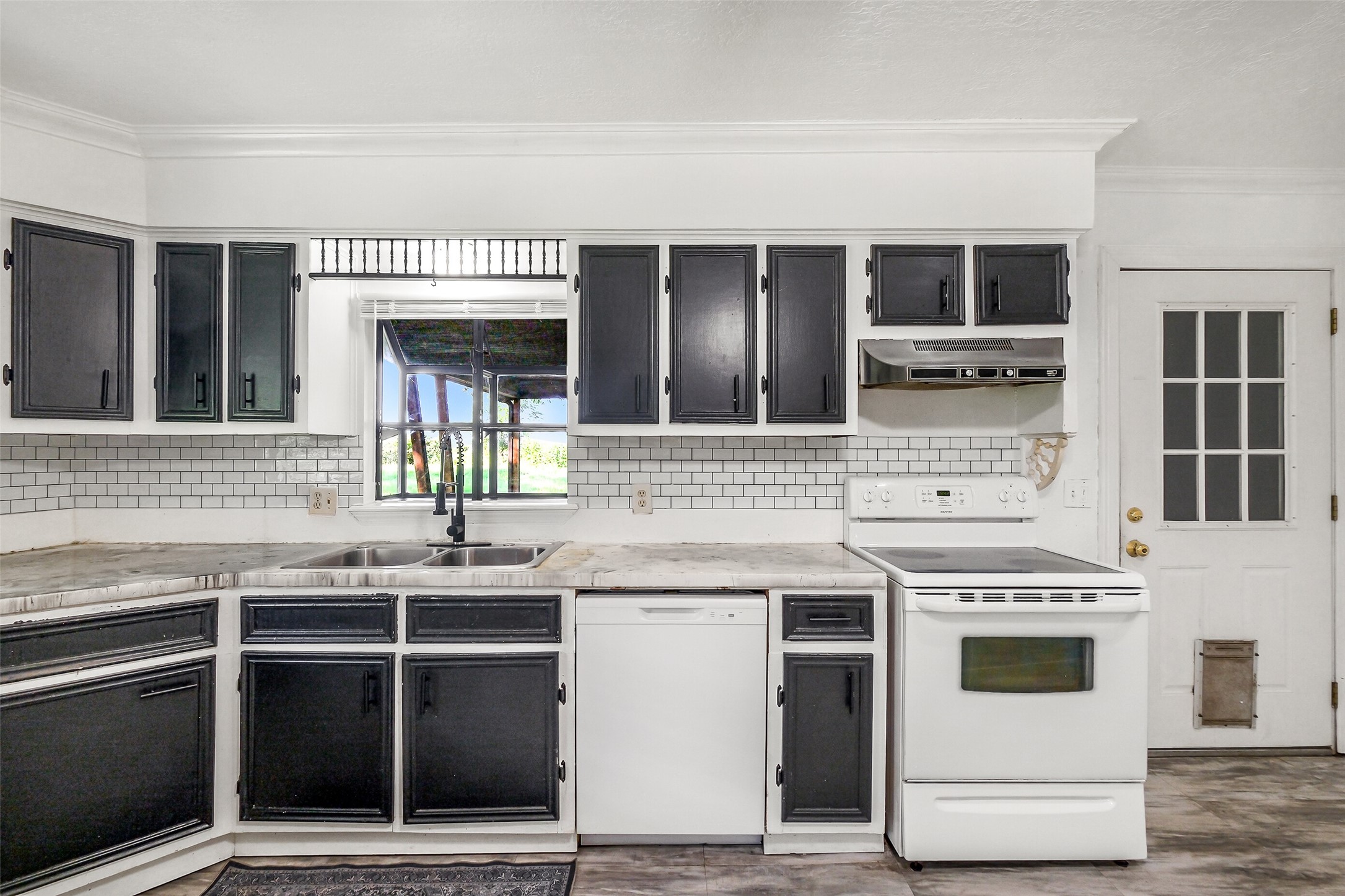9503 Cardinal Road Beasley, TX 77417 - Photo 9 of 27 a kitchen with stainless steel appliances granite countertop a stove and a sink