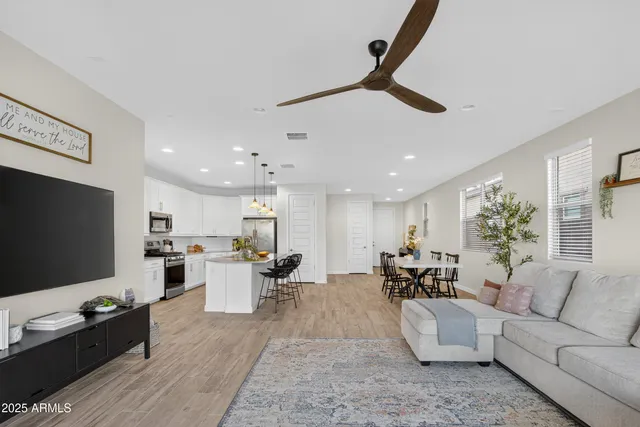 a living room with furniture and a table