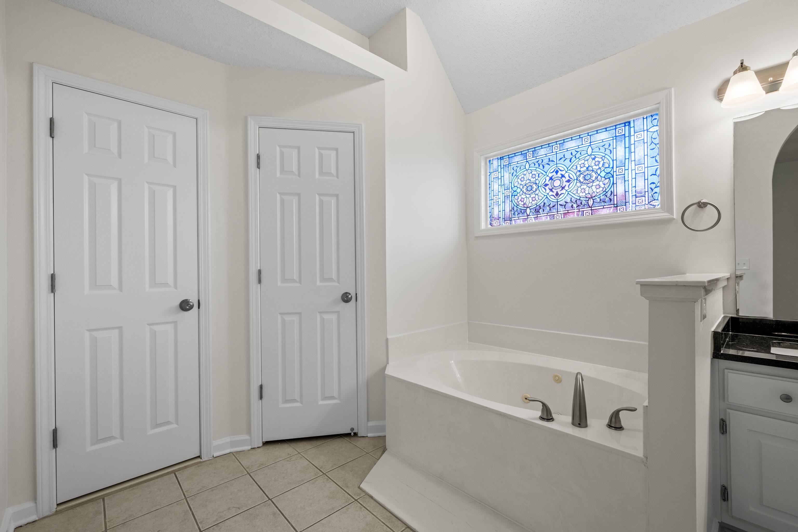 8016 Cale Falls Lane Bartlett, TN 38002 - Photo 20 of 37 a bathroom with bathtub and shower
