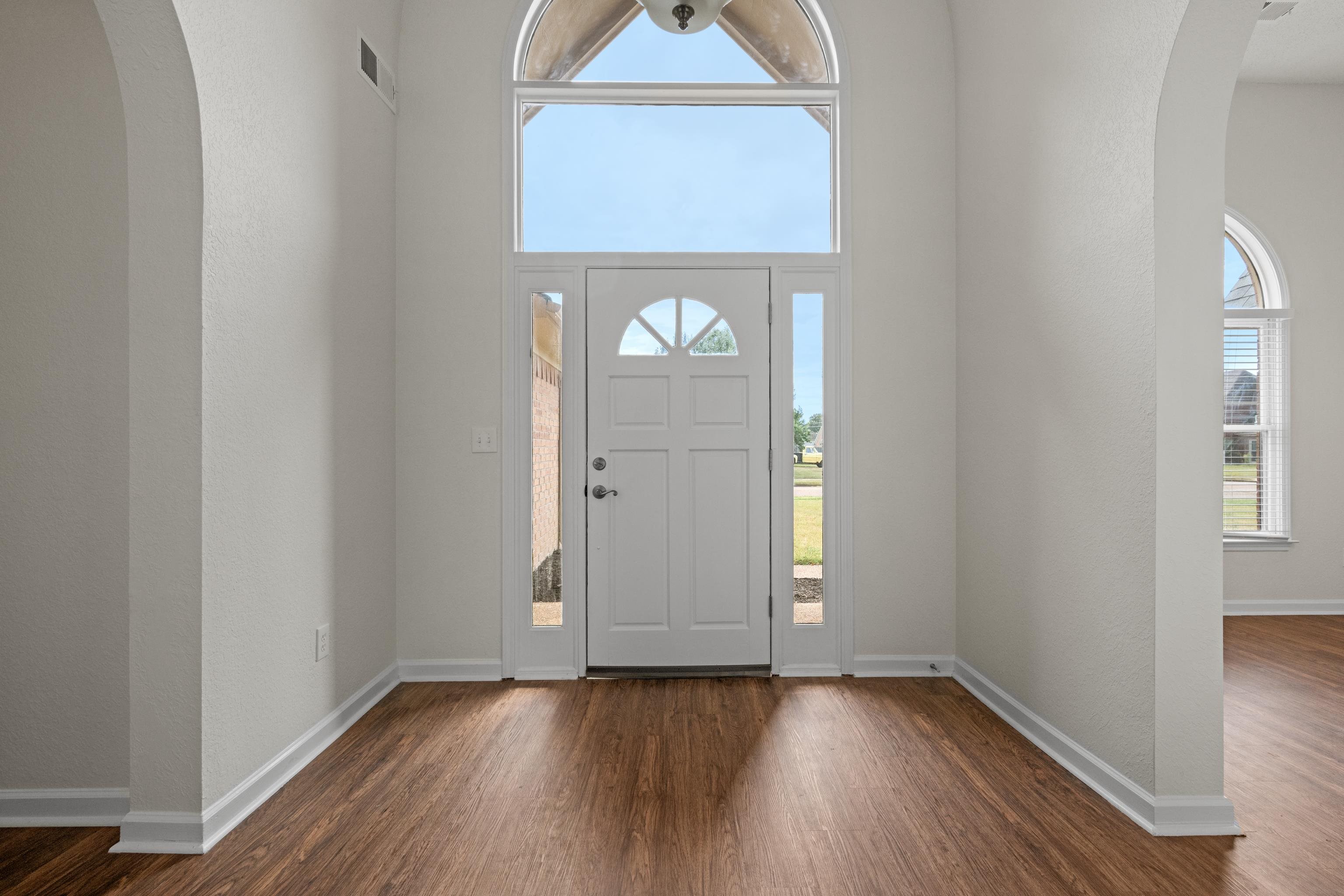 8016 Cale Falls Lane Bartlett, TN 38002 - Photo 3 of 37 a view of an entryway with wooden floor