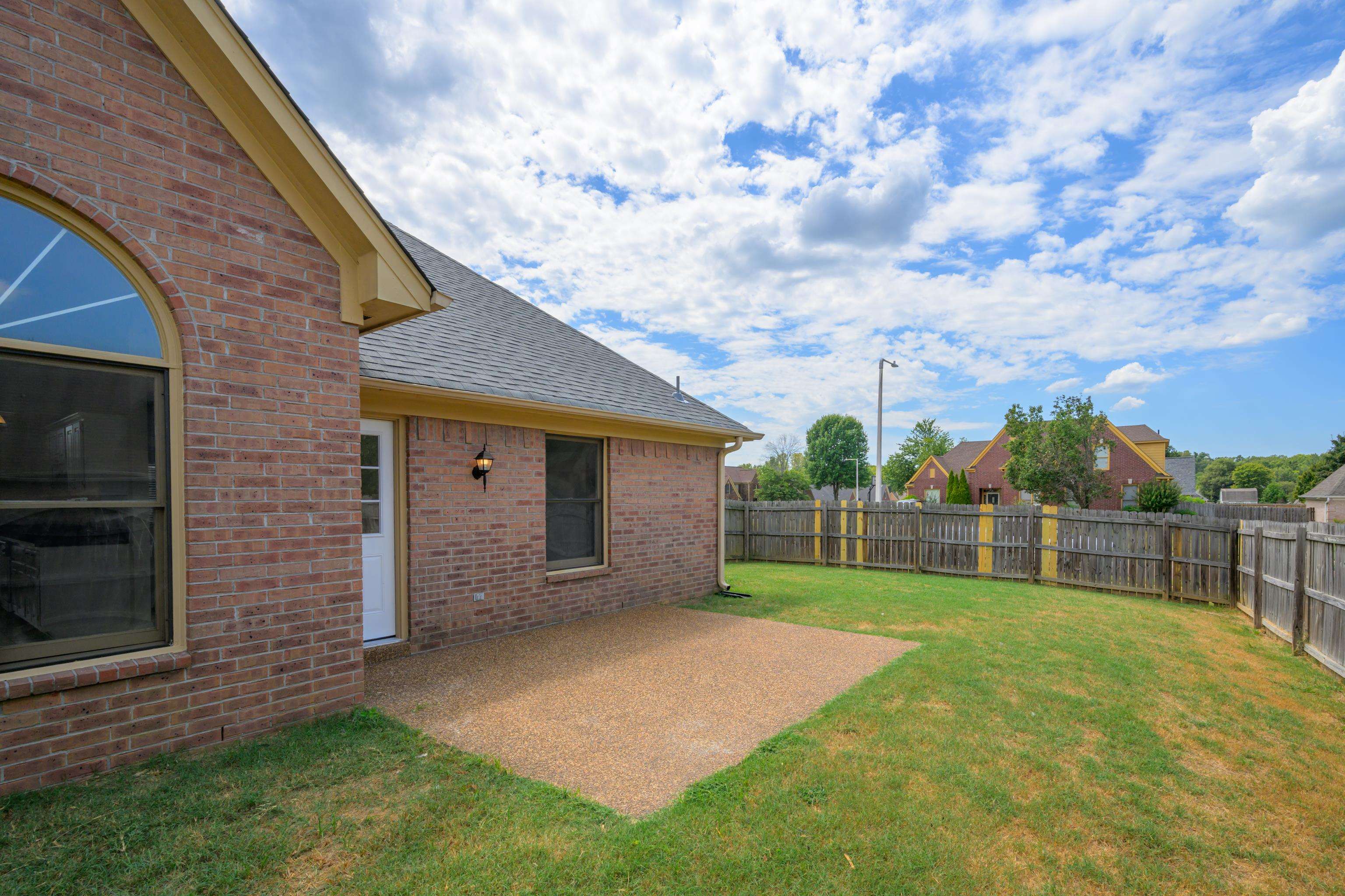 8016 Cale Falls Lane Bartlett, TN 38002 - Photo 31 of 37 a view of a backyard with a small cabin