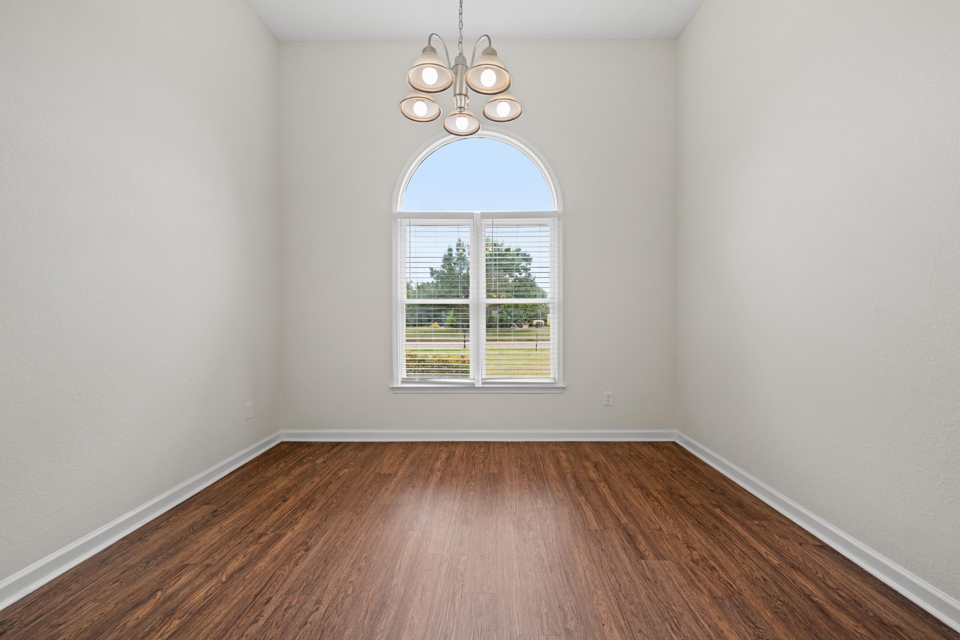8016 Cale Falls Lane Bartlett, TN 38002 - Photo 10 of 37 wooden floor in an empty room with a window