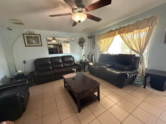 a living room with furniture and a window