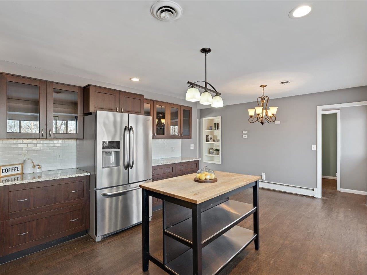 8210 Ridgewood Road Rock Island, IL 61201 - Photo 29 of 60 a kitchen that has a lot of cabinets and wooden floor