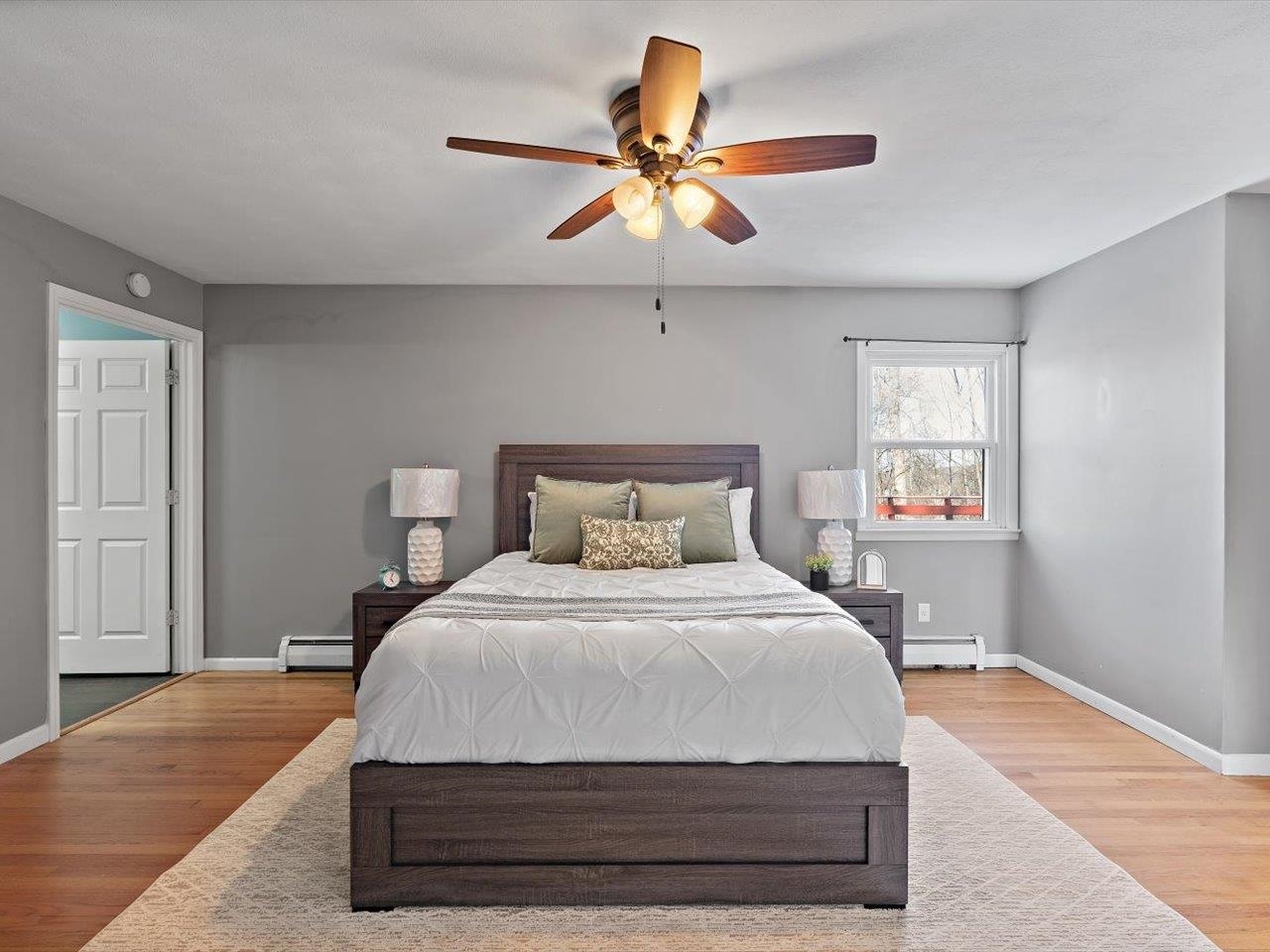 8210 Ridgewood Road Rock Island, IL 61201 - Photo 33 of 60 a bedroom with a bed and a ceiling fan