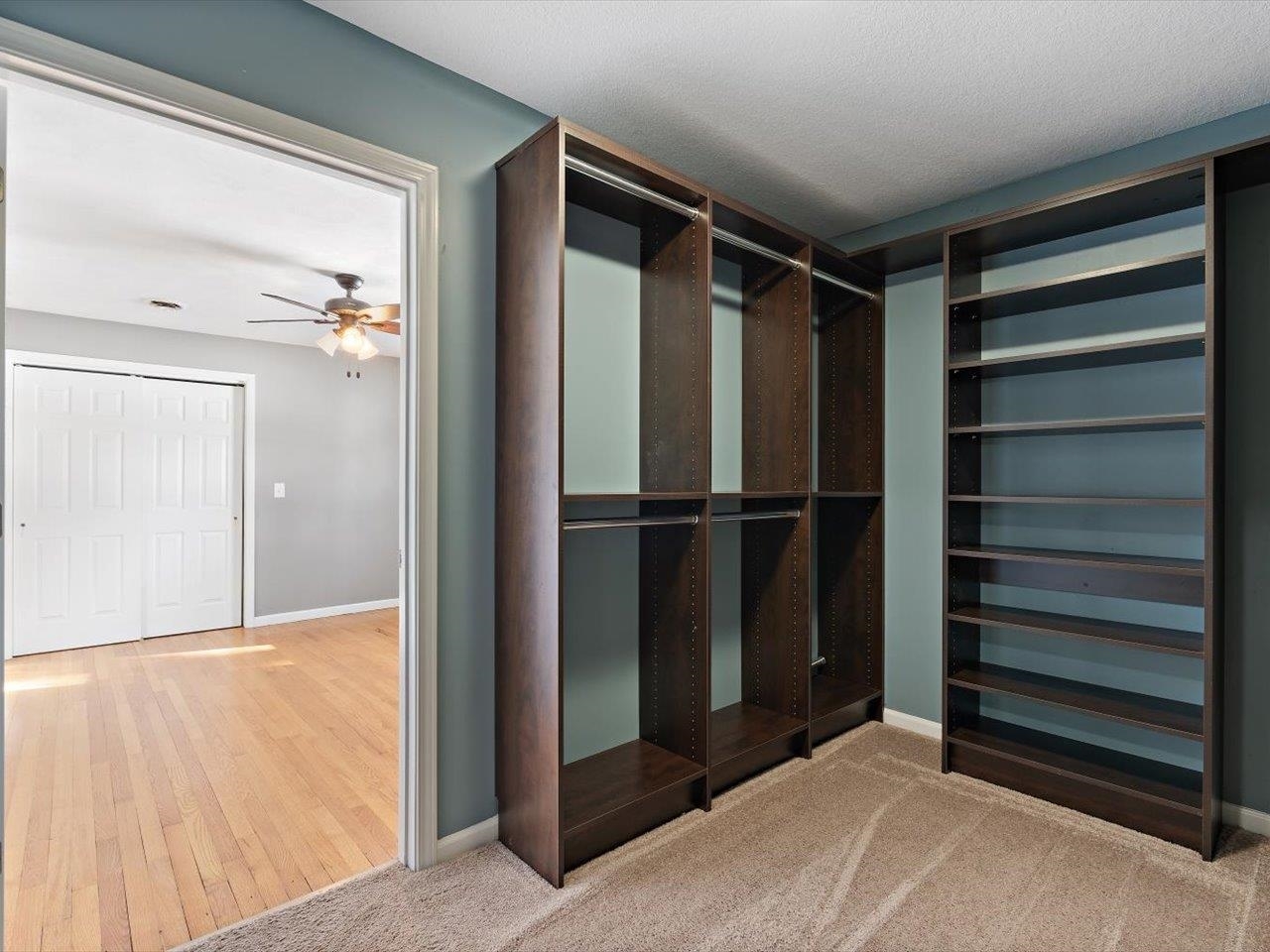 8210 Ridgewood Road Rock Island, IL 61201 - Photo 39 of 60 a view of walk in closet with empty racks