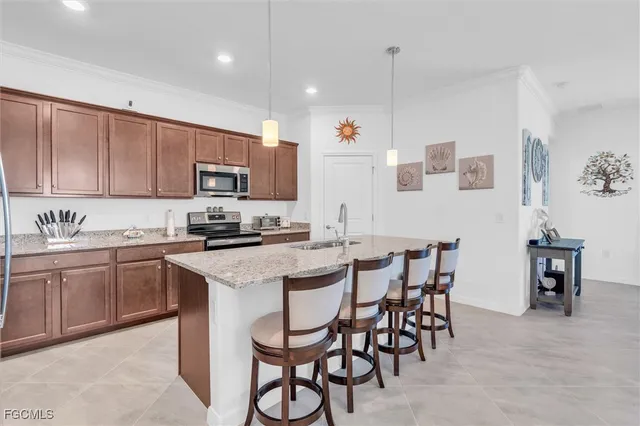 a view of a dining room with furniture and a chandelier
