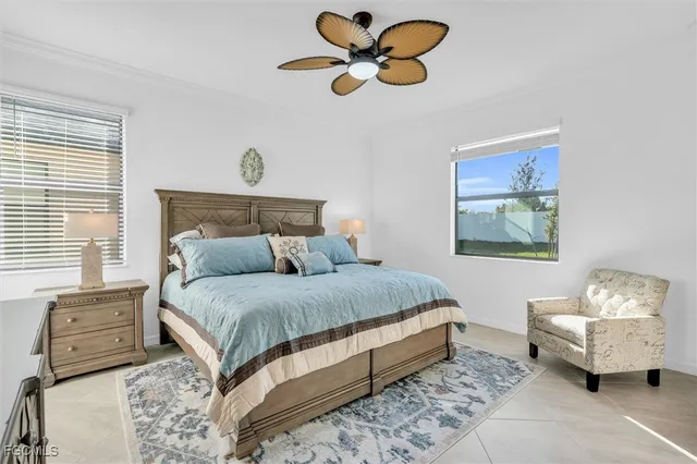 a bedroom with bed and a chandelier