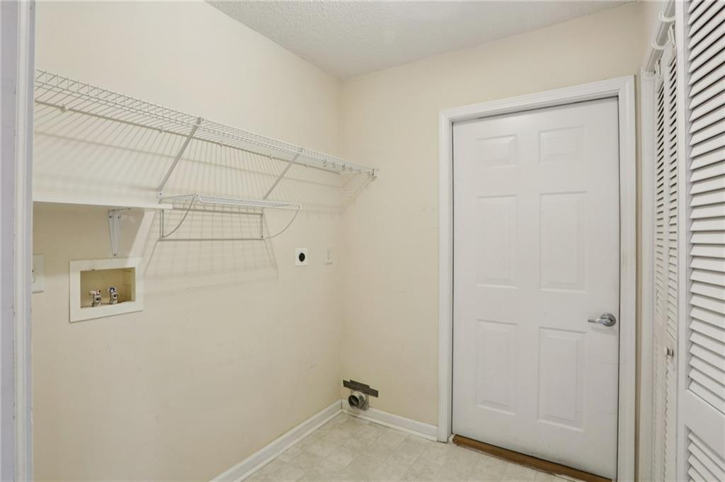 2191 Rockbridge Road Southwest, Unit 1301 Stone Mountain, GA 30087 - Photo 12 of 22 a bathroom with a shower