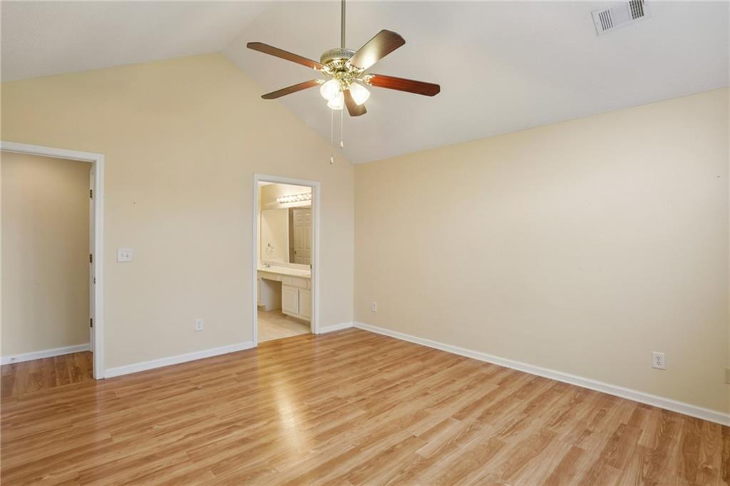 2191 Rockbridge Road Southwest, Unit 1301 Stone Mountain, GA 30087 - Photo 14 of 22 a view of an empty room with wooden floor