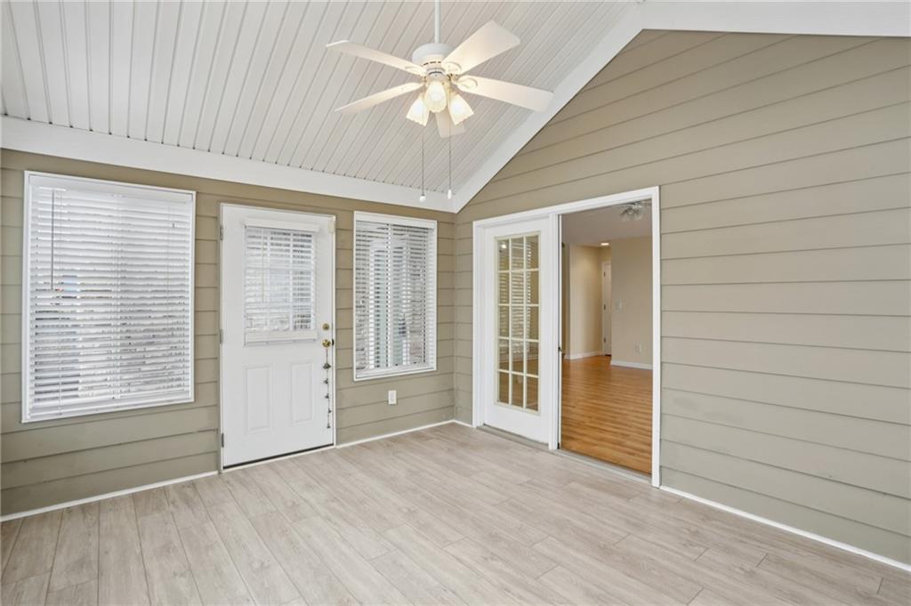 2191 Rockbridge Road Southwest, Unit 1301 Stone Mountain, GA 30087 - Photo 8 of 22 wooden floor in an empty room with a window