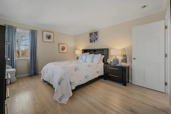 a bedroom with furniture and a window