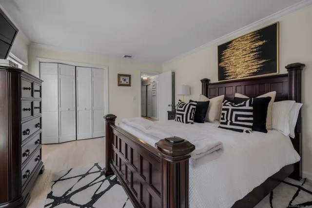 a view of a patio with table and chairs and potted plants