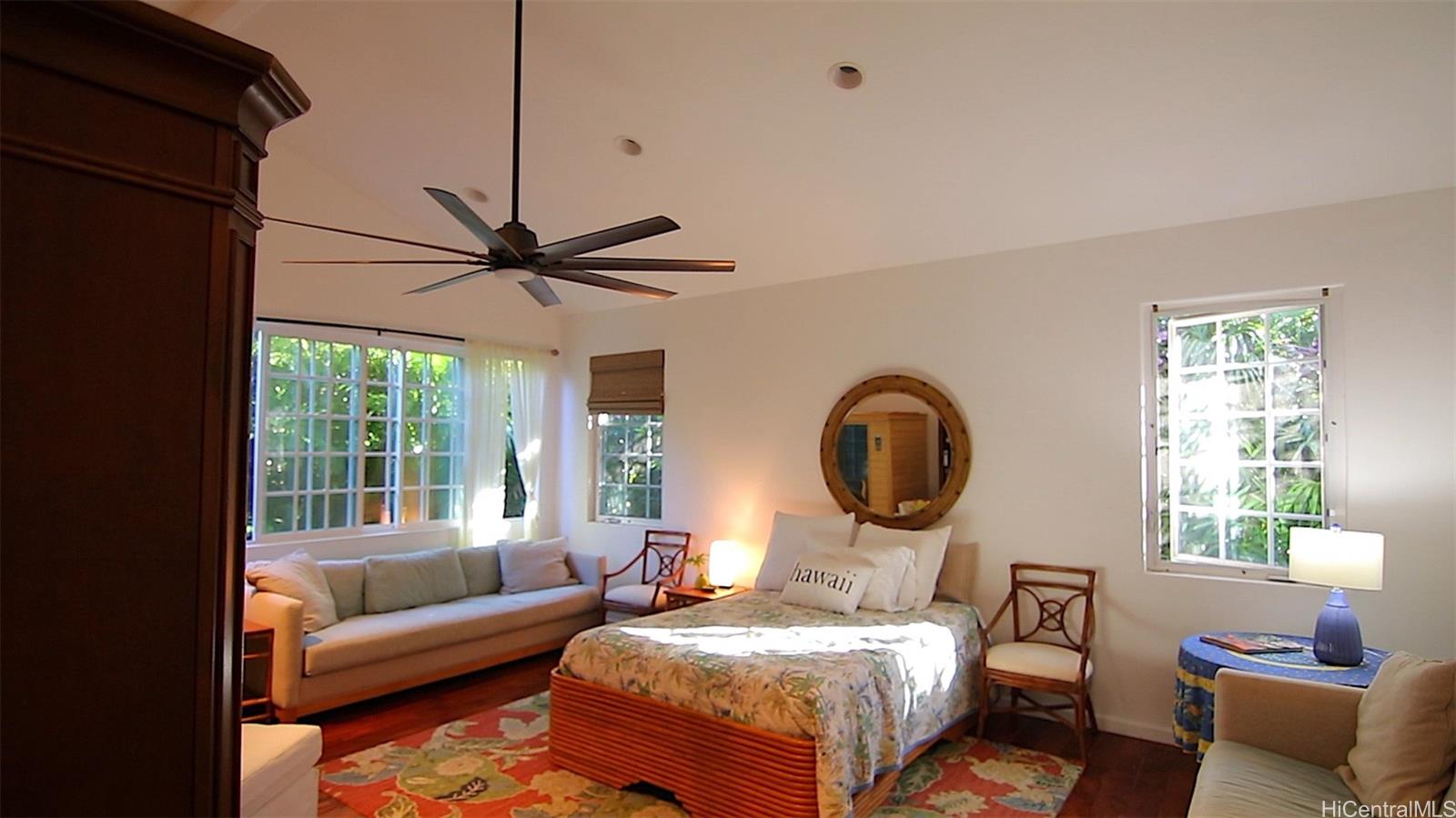 469 Portlock Road, Unit A Honolulu, HI 96825 - Photo 14 of 25 a living room with a couch and a window