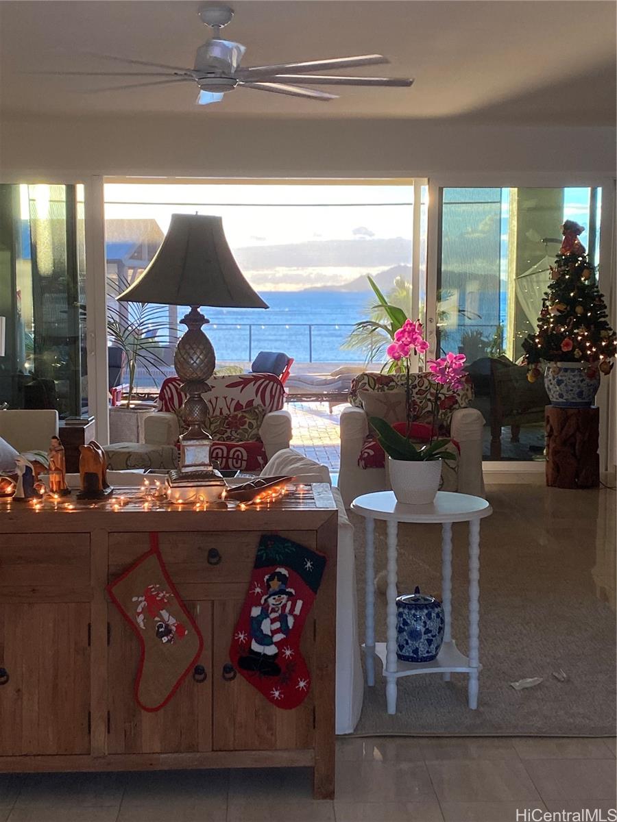 469 Portlock Road, Unit A Honolulu, HI 96825 - Photo 17 of 25 a room with furniture and a chandelier