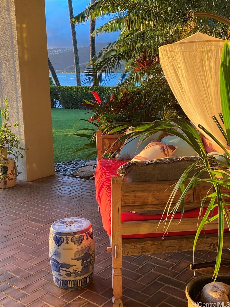 469 Portlock Road Honolulu, HI 96825 - Photo 19 of 25 a view of a swimming pool with a bench and some plants