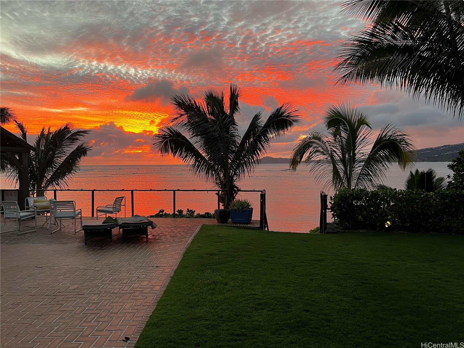 469 Portlock Road Honolulu, HI 96825 - Photo 2 of 25 a view of a house with garden and trees