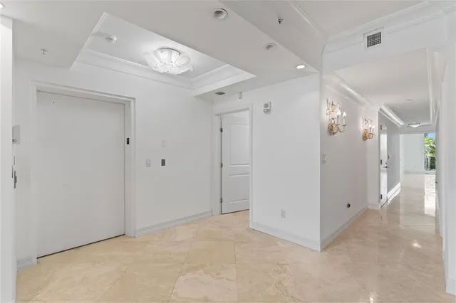 a spacious bedroom with a bed and a large window