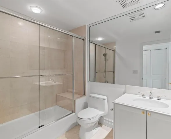 a kitchen with granite countertop a sink and cabinets
