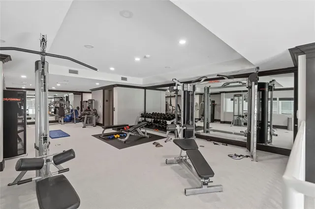 a living room with furniture large window and table