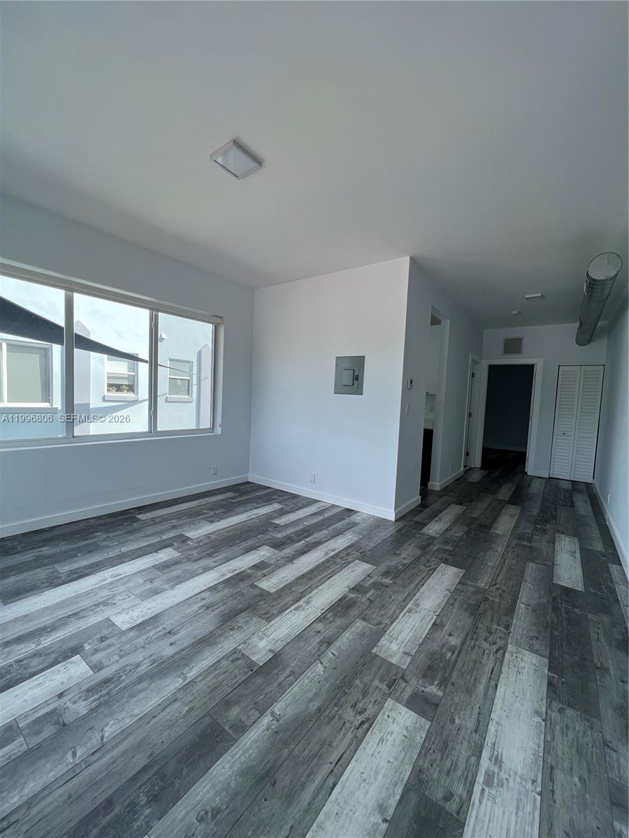 1818 Southwest 22nd Avenue, Unit 1 Miami, FL 33145 - Photo 2 of 18 a view of empty room with windows