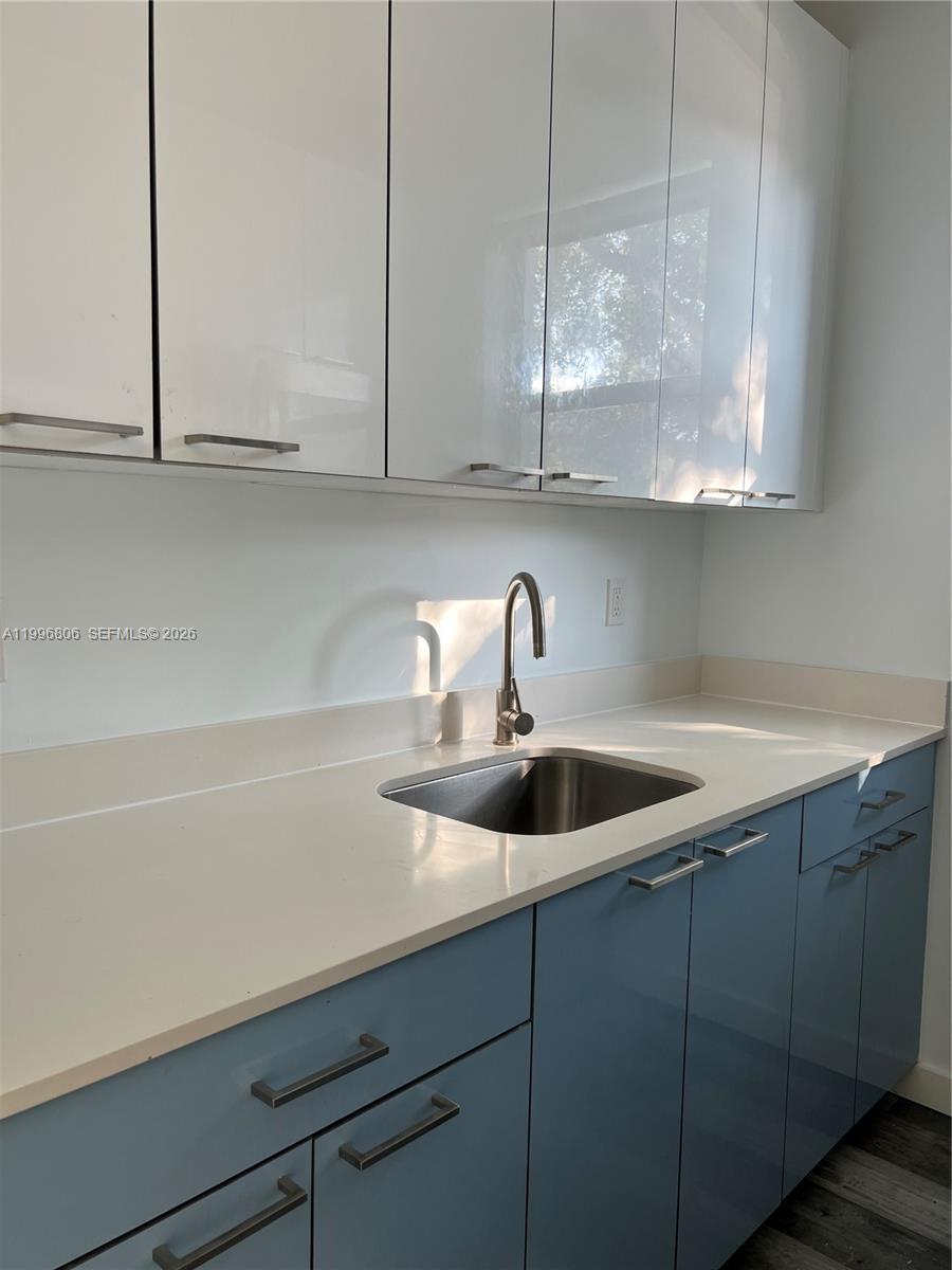 1818 Southwest 22nd Avenue, Unit 1 Miami, FL 33145 - Photo 5 of 18 a kitchen with a sink and cabinets