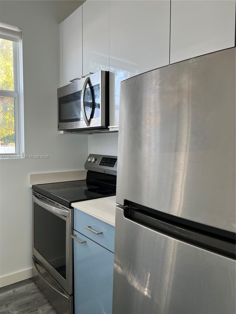 1818 Southwest 22nd Avenue, Unit 1 Miami, FL 33145 - Photo 6 of 18 a utility room with washer and dryer