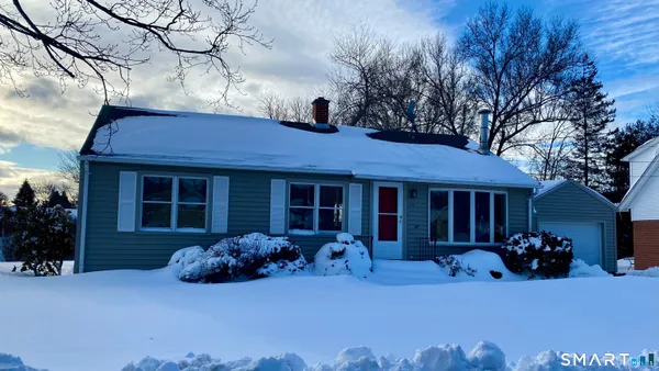 a front view of a house with a patio