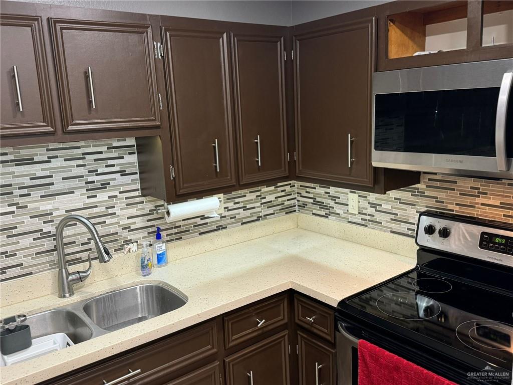 2004 Mynah Avenue McAllen, TX 78504 - Photo 3 of 10 a kitchen with a sink stove and microwave