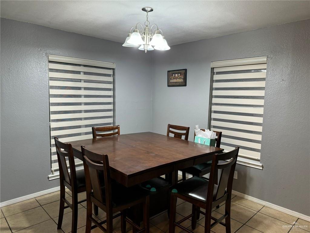 2004 Mynah Avenue McAllen, TX 78504 - Photo 5 of 10 a view of a dining room with a table and chairs