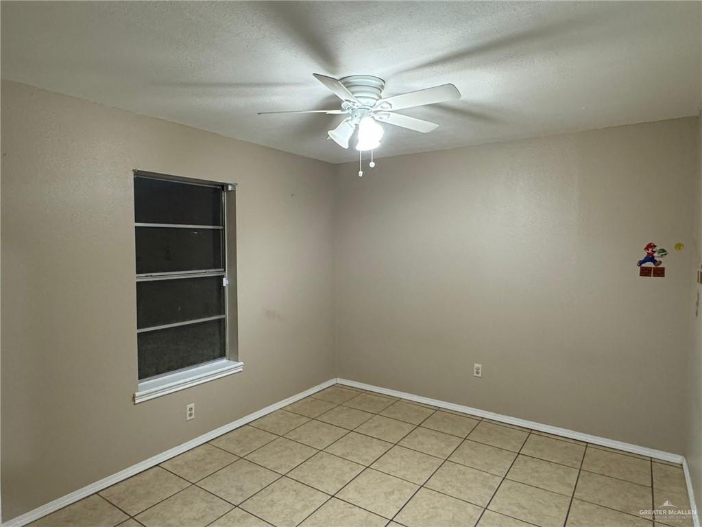 2004 Mynah Avenue McAllen, TX 78504 - Photo 8 of 10 an empty room with closet and fan