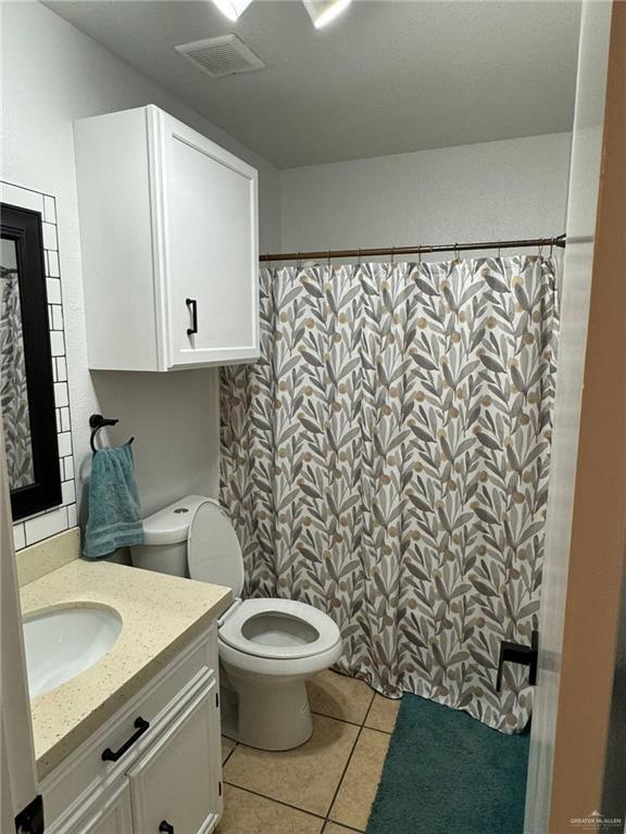 2004 Mynah Avenue McAllen, TX 78504 - Photo 9 of 10 a bathroom with a toilet sink and mirror