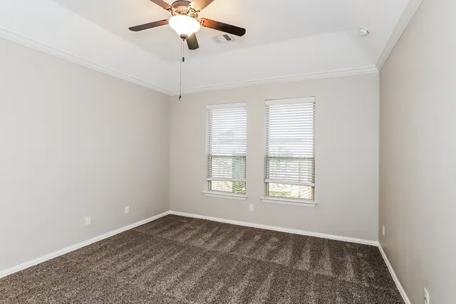 a bedroom with a large bed and a tv